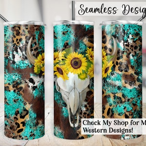 May include: A turquoise, brown, and gold patterned tumbler with a white cow skull and sunflowers. The tumbler is seamless and has a "Check My Shop for More Western Designs!" text at the bottom.