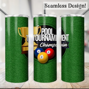 May include: Green tumbler with a white and black circle design. The circle has the text "Pool Tournament Champion" and a gold trophy with three billiard balls.