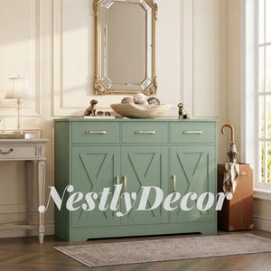 May include: A sage green sideboard featuring three drawers and three cabinets with X-shaped panel detailing and gold-toned hardware. The piece is positioned in a room with a mirror, a lamp, and a brown umbrella stand. The text NestlyDecor is visible.