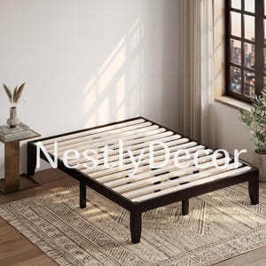 May include: A low-profile bed frame constructed from dark brown wood, featuring a slatted base design. The frame stands on four sturdy legs and is positioned in a room with light-colored walls. The text NestlyDecor is overlaid on the image.