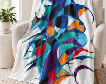 May include: A white fleece throw blanket featuring a large, central abstract design composed of intersecting lines and shapes in vibrant shades of blue, purple, red, orange, black, and teal, creating a complex, multi-colored geometric pattern.
