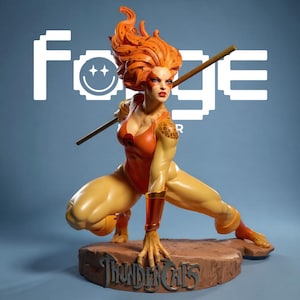 May include: A collectible figurine of a character with vibrant orange hair, wearing a red and yellow bodysuit with leopard print accents on the shoulders. The figure holds a staff, crouches on a rocky base labeled ThunderCats, and stands before a logo.