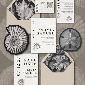 May include: A wedding stationery set featuring white cards with black text, including a save the date, invitation, RSVP card with a QR code, and details card. Two beige envelopes have black and white seashell and coral interior patterns.