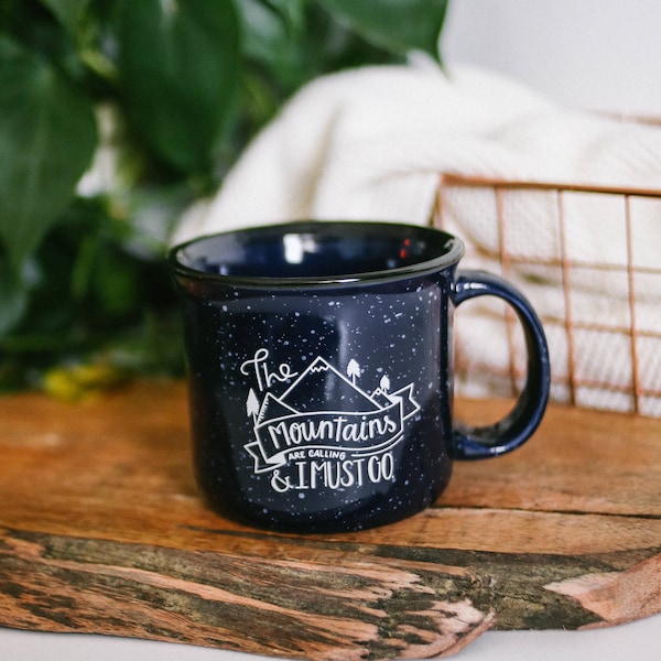 The Mountains are Calling, And I Must Go | Campfire Mug | Mountains Mug | Camping Mug - Speckled | Navy | Coffee Mug | 15 oz. | Stoneware