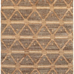 Low-angle folded shot emphasizing the highly durable and fully reversible zero-pile flatweave texture, standing out as an elite livingroom rug that gracefully outperforms rigid southwestern rug styles or traditional navajo rugs.