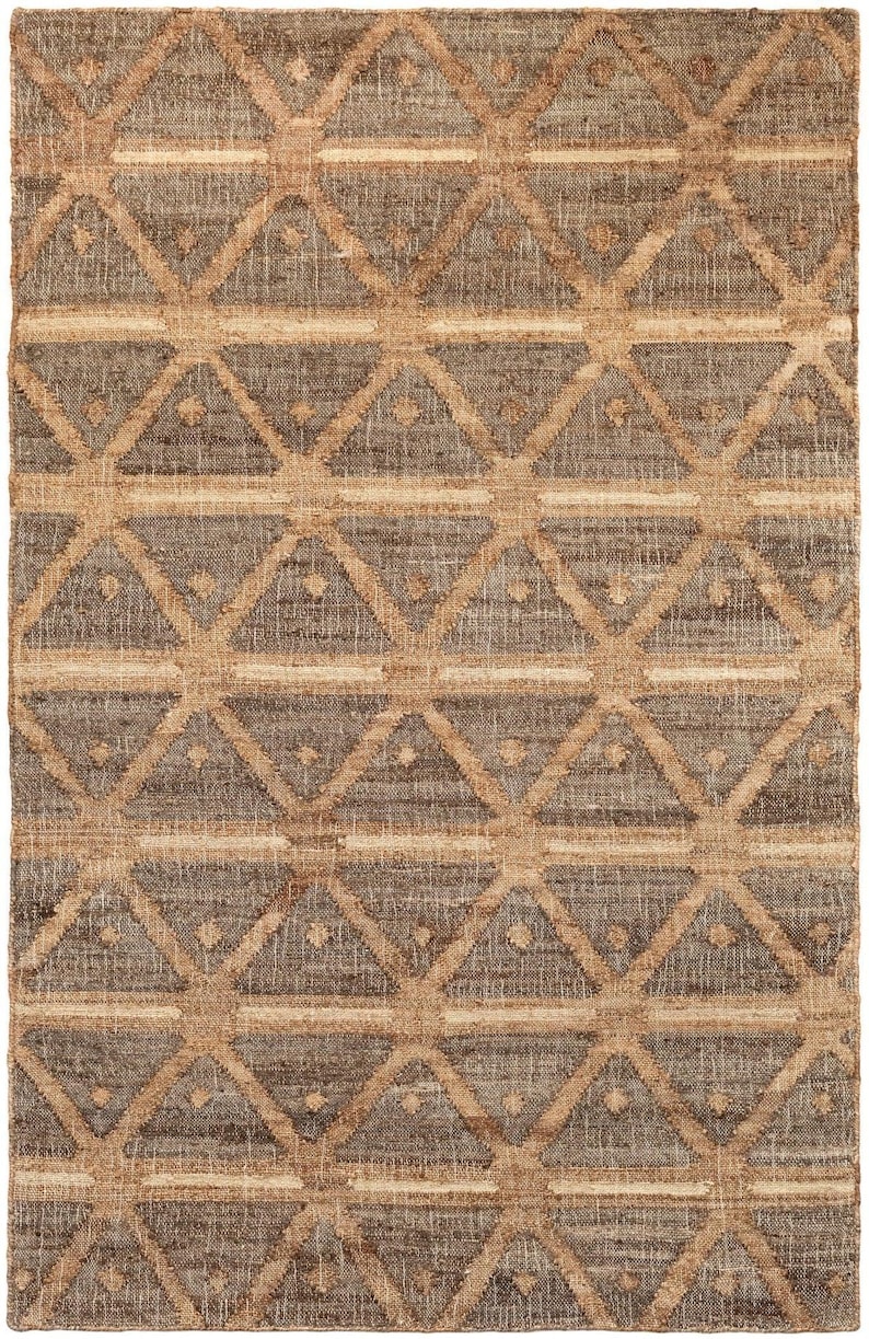 Low-angle folded shot emphasizing the highly durable and fully reversible zero-pile flatweave texture, standing out as an elite livingroom rug that gracefully outperforms rigid southwestern rug styles or traditional navajo rugs.
