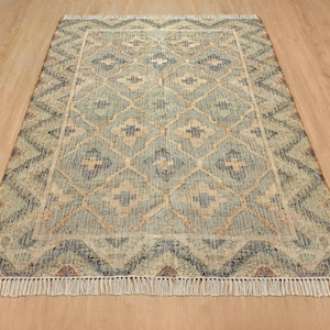 Sunlit room highlighting the bright natural cream base under modern minimalist furniture, acting as a superior, grounding Cool rugs alternative for eco-conscious interiors without the visual bulk of a heavy victorian rug.