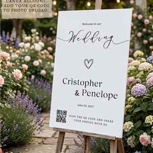 May include: A white rectangular wedding welcome sign on a wooden easel featuring the text Welcome to our Wedding, the names Cristopher & Penelope, the date June 20, 2027, a heart icon, and a QR code with the text SCAN THE QR CODE AND SHARE YOUR PHOTOS WITH US.
