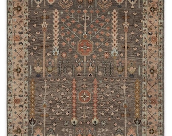 May include: A rectangular area rug featuring a dark grey field with a central tree of life motif in shades of coral, cream, and sage green. The border displays a repeating floral pattern in muted earth tones, framing the intricate botanical design.
