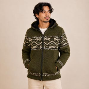 May include: A dark olive green zip-up hooded jacket featuring a black interior lining and a white and dark grey geometric patterned band across the chest, sleeves, and hem. The jacket includes a full-length black zipper and two front pockets.