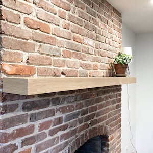 Custom White Oak fireplace mantel, built for you! Easy install using included French cleat. We use rift, quarter & live-sawn white oak hardwood, which has been locally sourced from specialty wood shops! Any dimension available. 

Mantle, wooden beam