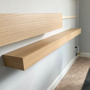 Custom White Oak fireplace mantel, built for you! Easy install using included French cleat. We use rift, quarter & live-sawn white oak hardwood, which has been locally sourced from specialty wood shops! Any dimension available. 

Mantle, wooden beam