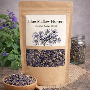 May include: A brown paper pouch labeled LuvHerbs Blue Mallow Flowers (Malva Sylvestris) with a clear window showing dried purple and green flower petals. A wooden bowl and spoon filled with the same dried flowers sit in front of the pouch.