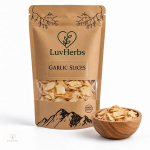 May include: A brown paper stand-up pouch labeled LuvHerbs Garlic Slices with a clear window showing dried garlic pieces. A small wooden bowl filled with the same dried garlic slices sits next to the pouch. The pouch features a mountain graphic.
