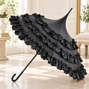 May include: A black pagoda-style umbrella featuring three distinct tiers of ruffled fabric trim along the edge. The umbrella has a pointed top, a curved handle, and a sleek, solid black canopy design that maintains a structured, flared shape.