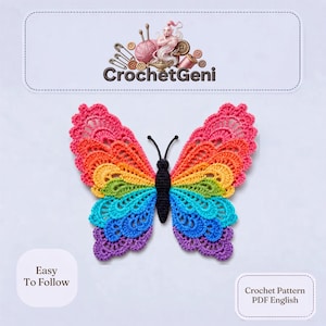 May include: A crochet butterfly applique featuring a rainbow color gradient across its wings, starting with pink at the top and transitioning through orange, yellow, green, blue, and purple at the bottom, with a solid black body and antennae.