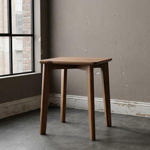 May include: A square wooden side table with a smooth, light brown finish. The table features four straight, slightly tapered legs connected by a cross-brace support structure underneath the flat top surface, providing a stable and balanced base.