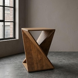 May include: A side table constructed from medium-toned brown wood featuring a geometric, twisted hourglass-shaped base with a flat square top and a matching square base, showcasing a visible natural wood grain texture throughout the entire structure.