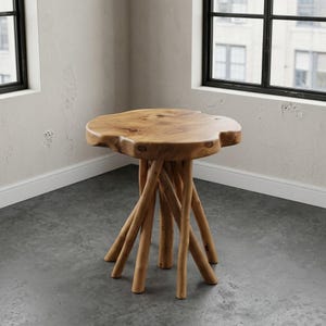 May include: A side table featuring a natural, irregular live-edge wooden top with visible grain and knots. The base is constructed from several thick, cylindrical wooden branches arranged in a tripod-like formation to support the tabletop.