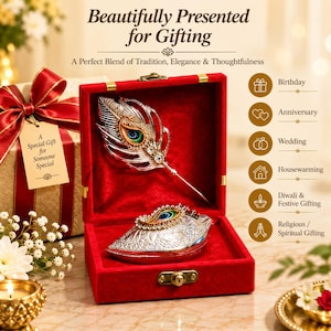 May include: A silver-toned peacock feather pen and a matching ornate box inside a red velvet-lined case. The set includes a gift tag reading A Special Gift for Someone Special and text stating Beautifully Presented for Gifting.