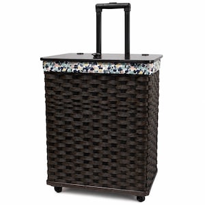 May include: A dark brown woven laundry hamper with a rectangular shape, featuring a black lid and a retractable black handle. The upper rim is decorated with a colorful patterned fabric band in shades of blue, pink, yellow, and white.