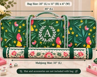May include: A rectangular green quilted bag featuring a pattern of pink birds, yellow flowers, and butterflies with a white letter A in a laurel wreath. The bag measures 35 inches long, 11 inches high, and 6 inches wide. A rolled floral mat is in front.