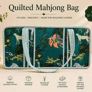 May include: A rectangular quilted Mahjong bag in dark green with a tropical print featuring cheetahs and orange flowers. The bag has white and green striped trim and handles, measuring 22 inches by 11 inches by 6 inches.