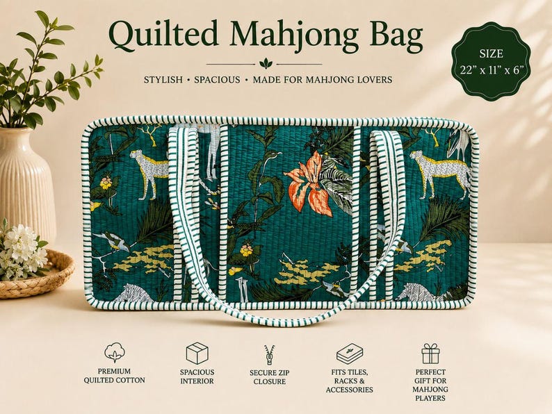 May include: A rectangular quilted Mahjong bag in dark green with a tropical print featuring cheetahs and orange flowers. The bag has white and green striped trim and handles, measuring 22 inches by 11 inches by 6 inches.