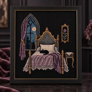 May include: A framed cross-stitch embroidery on black fabric depicting a bedroom scene with a bed, a black cat, a gothic window showing a moonlit night, purple curtains, and a small side table with a framed floral picture on the wall.