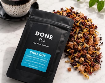 May include: A black pouch of Done Tea Chill Out loose leaf fruit tea with a blue label featuring the text Stop. Brew. That'll do. and 50g loose leaf tea. Beside the pouch is a pile of dried fruit and flower pieces and a cup of brewed tea.