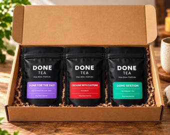 May include: A brown cardboard gift box containing three black pouches of loose leaf tea, each weighing 50g. The labels read Done Tea, Done For The Day Decaffeinated Earl Grey, I'm Done With Caffeine Rooibos, and Done Gestion Peppermint Tea.