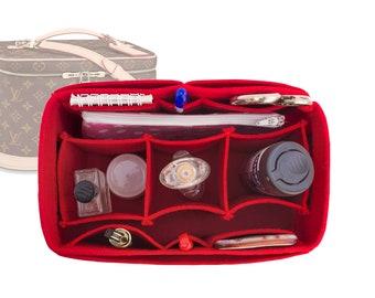 May include: Red felt organizer with multiple compartments for a makeup bag. The organizer is filled with various items, including a notebook, a pen, a small bottle of perfume, a clear bottle, a small white bottle, a clear bottle with a cap, a small white bottle, a gray bottle, and a small silver lighter.