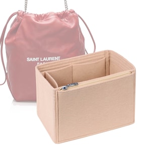 May include: Beige felt bag organiser with multiple compartments and a zipped pocket. The organiser is designed to fit inside a Saint Laurent handbag.