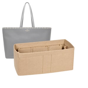 May include: A beige felt bag organizer with multiple compartments and pockets. The organizer is designed to fit inside a gray tote bag.