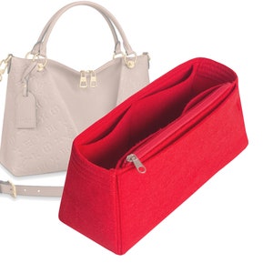 May include: A red felt bag insert with multiple compartments and a zippered closure. The insert is designed to fit inside a beige handbag.