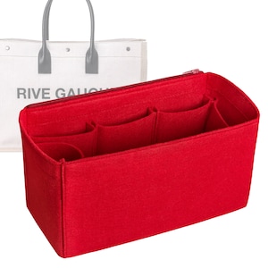 May include: Red felt bag organizer with multiple compartments and pockets. The organizer is designed to fit inside a tote bag.