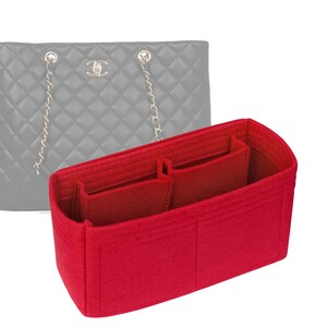 May include: Red felt bag organizer with multiple compartments for a tote bag.