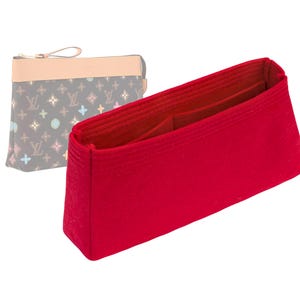May include: Red felt bag organiser with multiple compartments for a handbag.