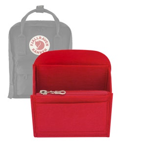 Peut inclure: Organiseur d'insert en feutre rouge pour sac à dos avec une poche zippée et un logo Fjällräven Kånken.