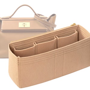 May include: Beige felt bag organizer with multiple compartments and a zipper closure. The organizer is designed to fit inside a handbag.