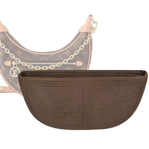 May include: Brown felt bag insert with two pockets. The insert is designed to fit inside a crescent-shaped handbag.