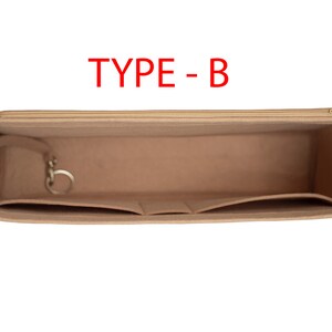 May include: Beige felt bag organizer with multiple pockets and a zipper closure. The organizer has a key ring and the text "TYPE - B" is printed on the top.