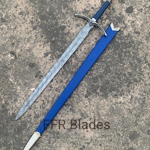 May include: A sword with a patterned Damascus steel blade, a blue leather-wrapped handle, and a silver-toned pommel and crossguard. The sword is accompanied by a blue scabbard with silver-toned metal fittings. The text FFR Blades is visible.