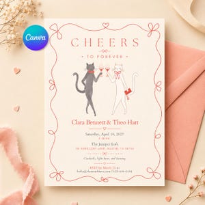 May include: A cream-coloured wedding invitation card featuring a red line-art border and two illustrated cats clinking glasses. The text reads Cheers to Forever, Clara Bennett & Theo Hart, Saturday, April 18, 2027, 6:30 PM, The Juniper Loft, 118 Crescent Lane, Austin, TX 78704.