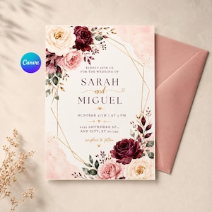 May include: A wedding invitation card featuring a geometric gold frame, watercolor floral accents in burgundy, cream, and blush pink, and text reading: Kindly join us for the wedding of Sarah and Miguel, October 31st, at 5 PM, 0123 Anywhere St.