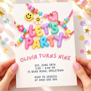 Può includere: Un invito di compleanno bianco con la scritta LET'S PARTY formata da perline di plastica colorate, con ciondoli a forma di faccina sorridente, fiore e cuore. Il testo riporta OLIVIA TURNS NINE, SAT, JUNE 28TH, 2:00 - 4:00 PM, 12 BEAD ROAD, SMILETOWN, RSVP TO JESSICA AT 0400 000 000.