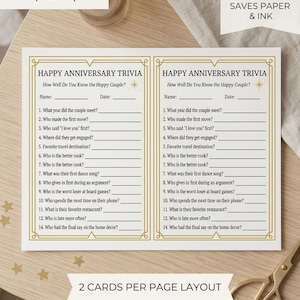 Peut inclure: Deux cartes de jeu Happy Anniversary Trivia blanches avec des bordures dorées sur une seule feuille. Chaque carte comporte 14 questions sur un couple, avec des lignes pour le nom et la date. Le texte inclut Saves Paper & Ink.