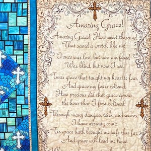May include: A quilted wall hanging with the text of the hymn "Amazing Grace." The quilt features a central panel with the hymn's lyrics, framed by a teal border and decorative crosses.