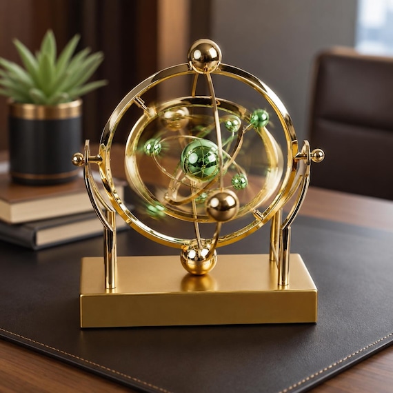 A gold celestial pendulum that mimics orbital motion — it's basically a mesmerizing desk orrery that never stops moving.
