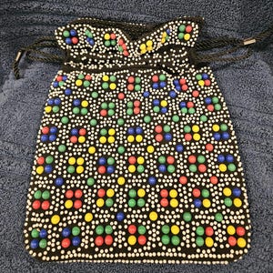 1970s Candy Dot Purse. Black with blue,green,red, yellow, white dots. Reversible, solid black. Hong Kong. 8.5x11 inches.  Drawstring